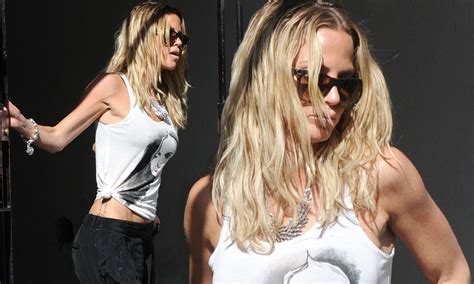 Sarah Harding Shows Off Her Tiny Waist With Low Slung Baggy Trousers And Her Top Rolled Up