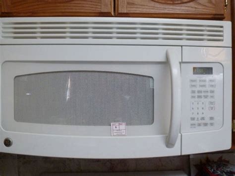 If the microwave is too low, moving dishes in and out of it can be a nuisance. GE under cabinet mount microwave with vent, 29.75"w x 16 ...
