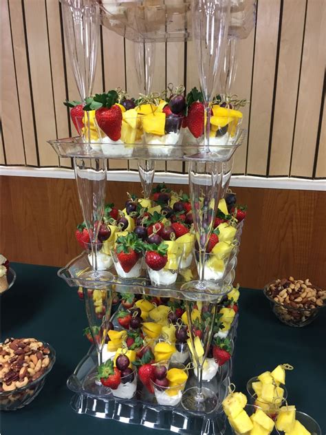 Fruit Cups On A Diy Tiered Display Made From Clear Plastic Trays And