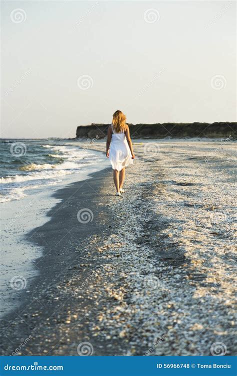 Woman Walking On The Sand Of The Beach Stock Photo Image Of Ocean