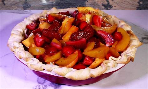 A pie is cooked beforehand: Peach & Strawberry Pie with Crumb Crust | Jan D'Atri