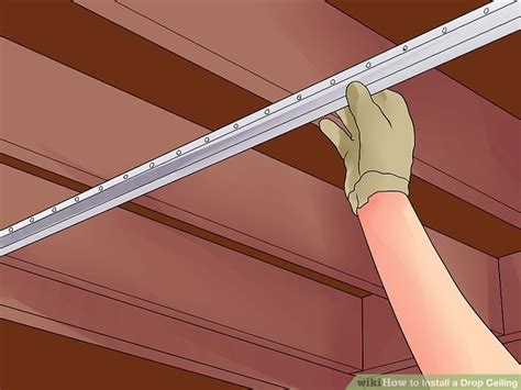 How to choose and install a suspended ceiling including a guide to fitting ceiling tiles. How to Install a Drop Ceiling: 14 Steps (with Pictures ...