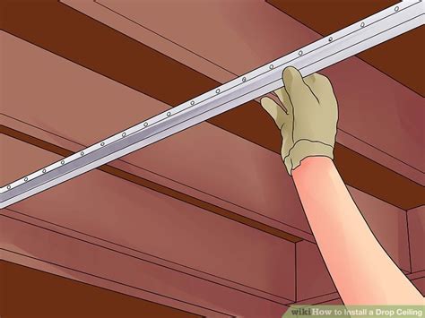 A suspended ceiling is a grid framework made of lightweight metal brackets hung on wires attached to ceiling or floor joists. Luxury 55 of How To Instal Drop Ceiling | costshere