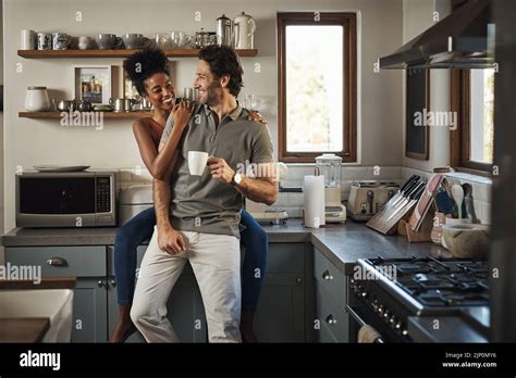 Happy In Love And Laughing While An Interracial Couple Enjoys Morning