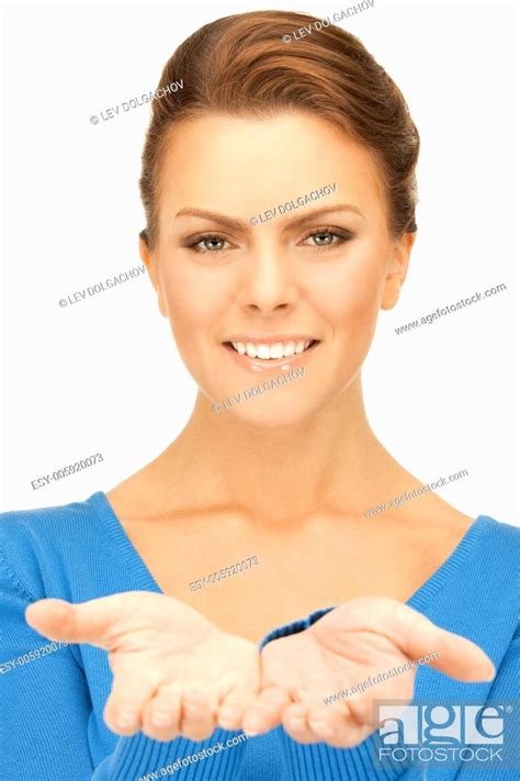 Beautiful Woman Showing Something On The Palm Of Her Hand Stock Photo