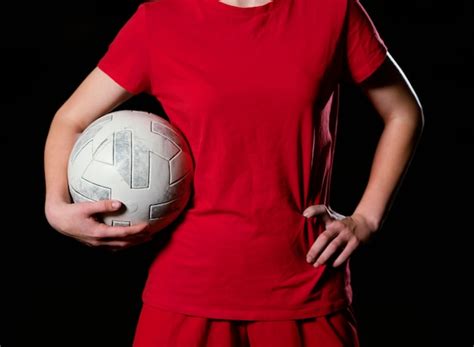 Free Photo Female Football Player Kicking Ball