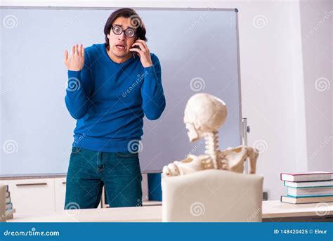 The Male Teacher And Skeleton Student In The Classroom Stock Image