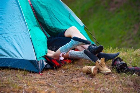 Feet Of Two People Lying In A Tent Camping Travel Tourism Hi Stock