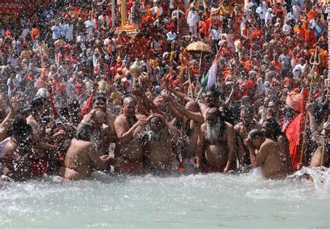 In Pics First Shahi Snan Of Kumbh Mela Thousands Of Devotees Take