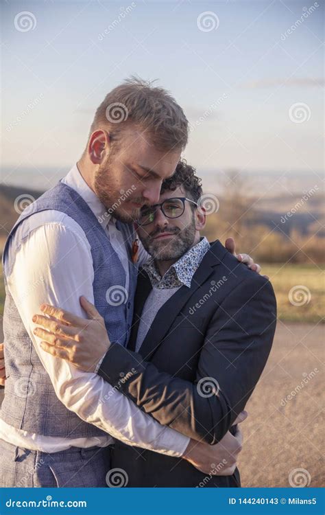 Gay Couple In Love Intimate Hugging Together Outdoors In Nature Stock