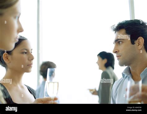 Office Party Man And Woman Glaring At Each Other Stock Photo Alamy