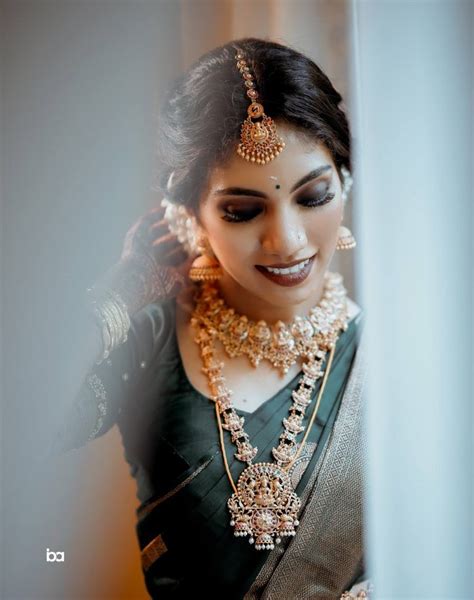 a stunning south indian bride in green kanjeevaram saree south indian wedding saree south