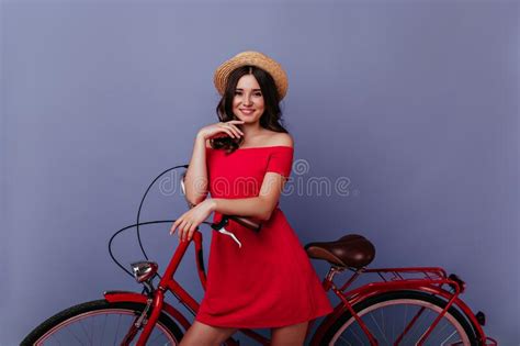 Enthusiastic Caucasian Girl Standing Near Bike With Pleased Smile