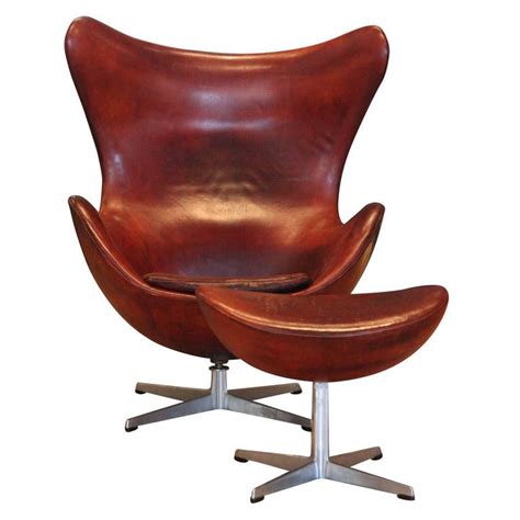 There are two major contenders that have a plausible claim one is the trademarked version, designed by arne jacobsen. Arne Jacobsen Egg Chair and Ottoman, Denmark, 1960 ...