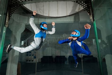 A Man And A Woman Enjoy Flying Together In A Wind Tunnel Free Fall
