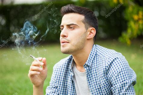 Man Smoking Cigarette Stock Photo By ©minervastock 55477497