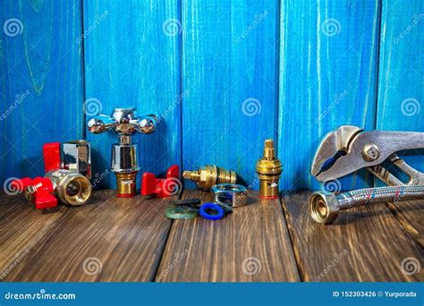 Plumbing Supplies And Tools On A Blue Wooden And Vintage Background