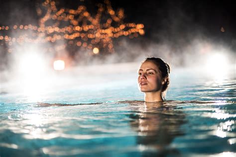 Woman Spending A Winter Night In A Heated Swimming Pool The