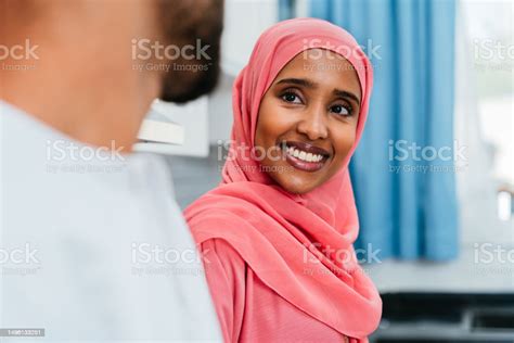 Happy Middle Eastern Couple Wearing Traditional Arab Clothing At Home