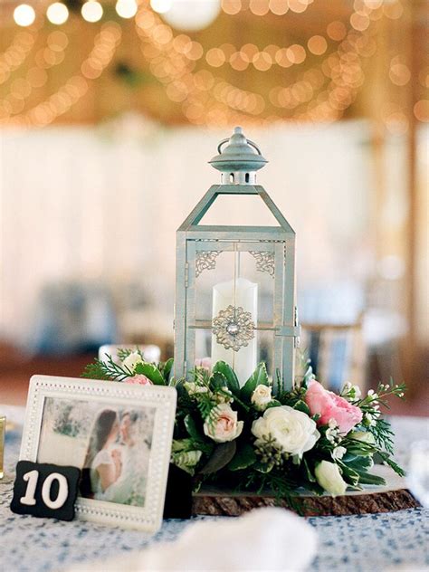 Lanterns will add cosiness to your wedding arrangement. Lantern Centerpiece Ideas