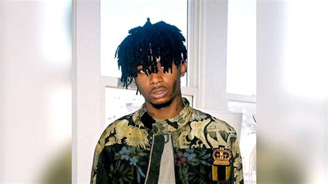 Playboi Carti In White Window Background Wearing Colorful Flowers