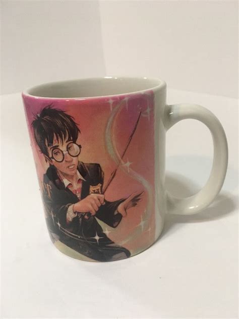 Harry uses it to explore the restricted section in the library to research information on nicolas flamel, a name hagrid lets slip when confronted about his knowledge of fluffy. 2000 Xpres Harry Potter and the Sorcerers Stone coffee mug ...