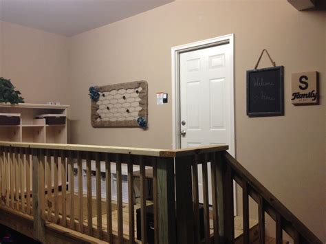 We have a pretty narrow entryway off the garage door so i decided to add a large set of mudroom lockers with a bench in the garage. Mudroom - Landing built in the garage | Garage stairs ...