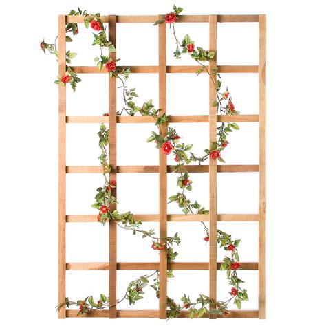With the glass removed, a cedar grid fits into the opening and provides sturdy support for a large climbing vine. Diamond Teak Wood Wall Trellis - Trellises at Hayneedle