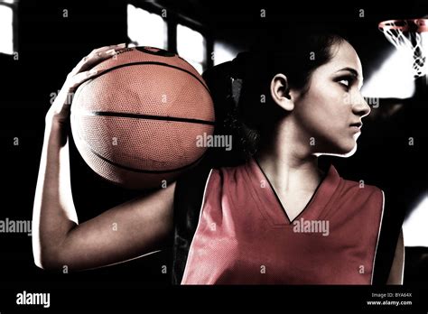 Girl Posing With A Basketball Stock Photo Alamy