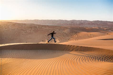 Man Running Alone In The Desert Stocksy United
