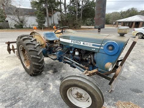 Vintage Old Working Ford 4100 Tractor Parked Front Corner View