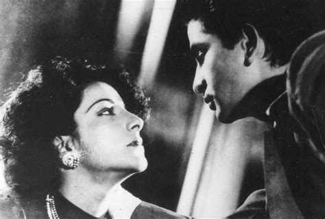 Raj Kapoor And Nargis In A Scene From The Film Aag Bollywood Photos Film World Handsome
