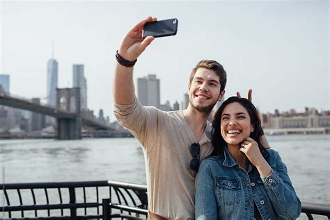 Happy Couple Taking A Selfie In Brooklyn By Stocksy Contributor Michela Ravasio Stocksy