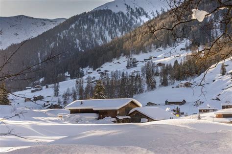 Snow Covered Farm In The Mountains Of Davos Switzerland Stock Image