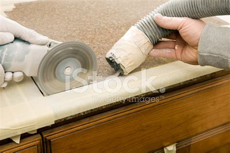 Maybe you would like to learn more about one of these? Workers Cutting Sink Hole IN A Granite Countertop Stock ...