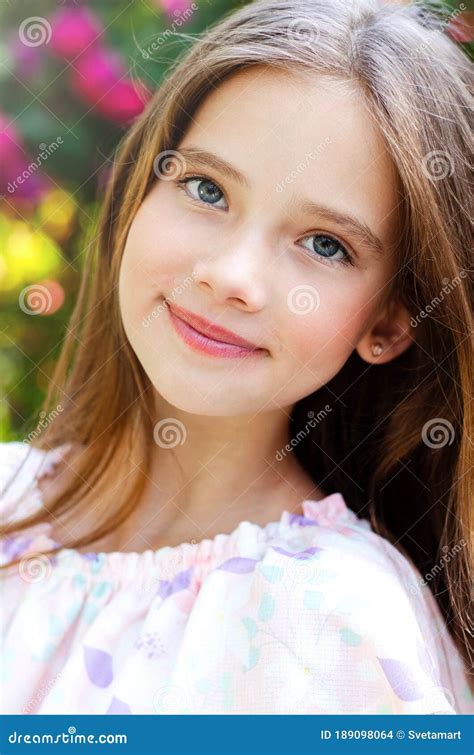 Portrait Of Adorable Smiling Little Girl Child In Summer Day Happy