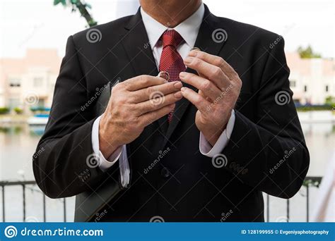 They form the covenant that establish the couple's marriage. Pastor Holding Wedding Rings In His Hands On Wedding Ceremony Stock Image - Image of wedding ...