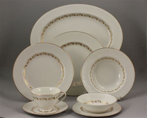 Flowers make the world a more beautiful place. A Royal Doulton 'Fairfax' pattern bone china part Dinner ...