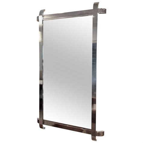 #224452, see more inspiration at decoratorist.com. Chrome Framed Mirror with Sculptural Curved Overlapping ...