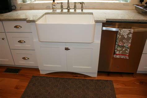 These sinks can add to a beautiful country kitchen look. This sink cabinet is 27" deep and has an arched valance ...