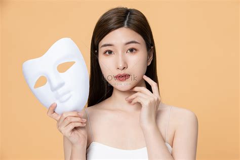 facial care of beautiful women holding mask picture and hd photos free download on lovepik