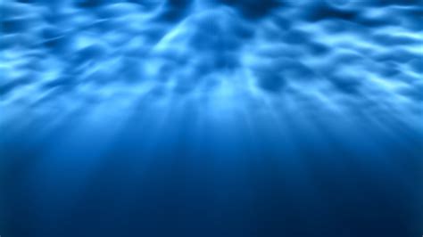Underwater Light Rays Shine Bright Underneath Rippling Ocean Waves 4k