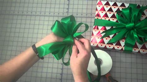 You can also use paper bows to decorate other items too, such as garlands, cards, or scrapbook pages. How to Make a 3 Loop Gift Bow by Lisa's Gift Wrappers ...
