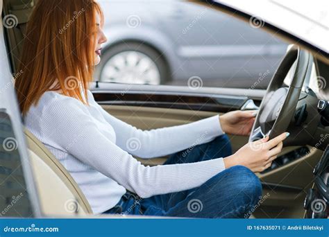 Young Woman Driver Meditating Behind A Wheel Of A Car Stock Image