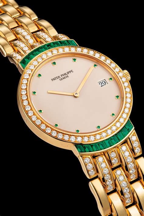 Patek Philippe An 18k Gold Diamond And Emerald Set Bracelet Watch