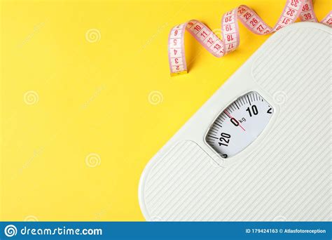 Scales And Measuring Tape On Background Weight Loss Concept Stock