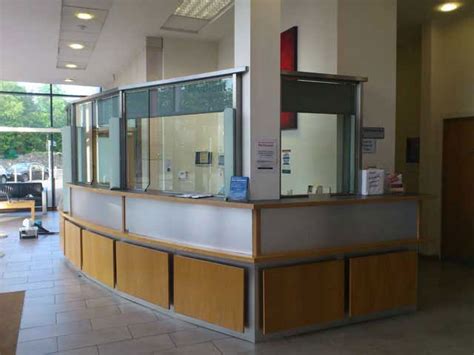 Modern open office with reception and glass partition. MetalWorx Glazed Security Screen 04 | MetalWorx Security ...