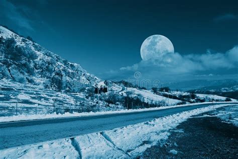 Moon In The Sky On Snowy Mountain Stock Photo Image Of December Road