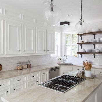 It's also a relatively small canvas that doesn't cost an arm and a leg to renovate if you change your mind and want to try. Taj Mahal Quartzite Countertops with White Kitchen ...