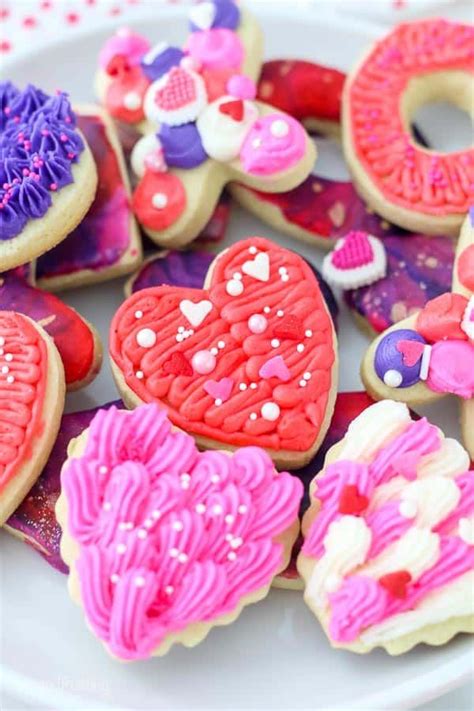 these adorable valentines day sugar cookies are decorated with vanilla buttercream t